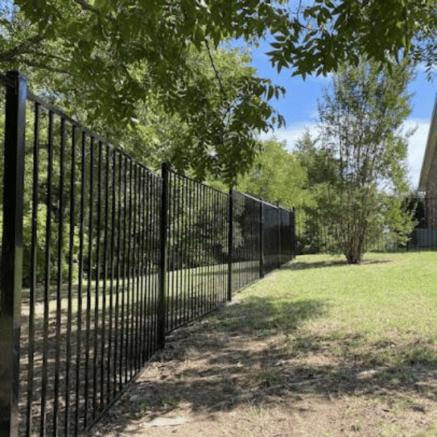Ornamental black metal fence installed along a Rockwall property line
