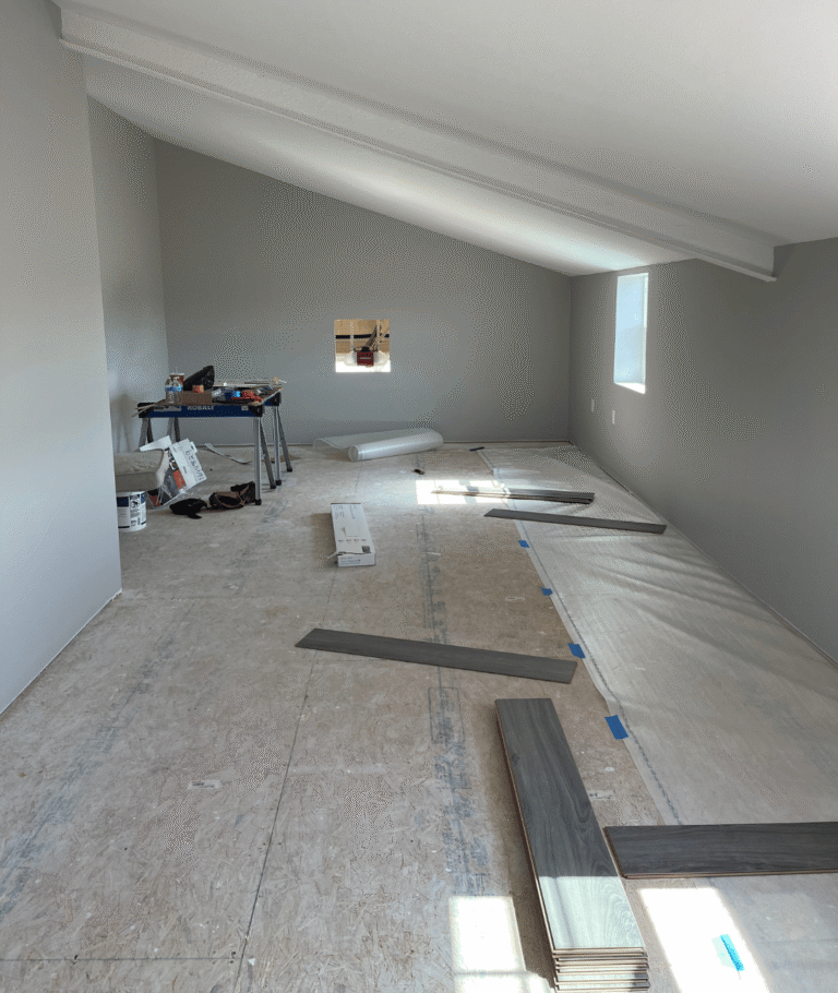 Spacious bonus room being converted into a man cave with new flooring underway