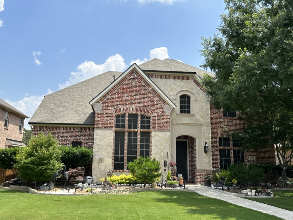 New roof on a stone-and-brick North Texas custom home