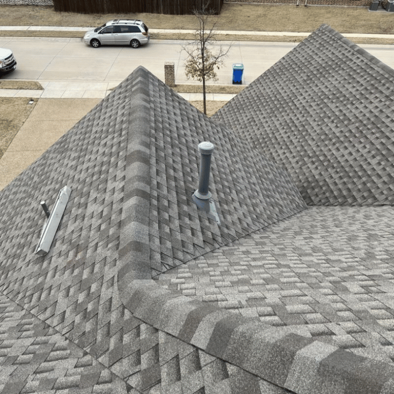 Aerial view of a Rockwall home roof being inspected after a hail storm